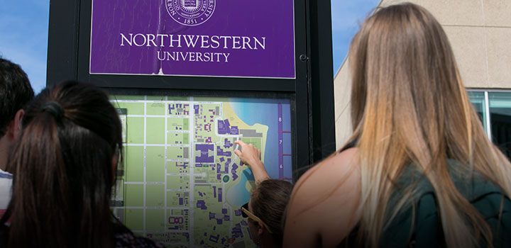 students looking at campus map