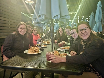Students dining on rooftop at night